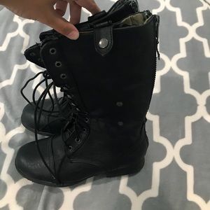 Combat style boots with camp design on the inside